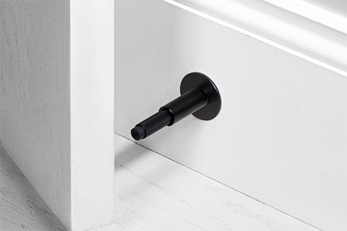 What are the functions of door stoppers?